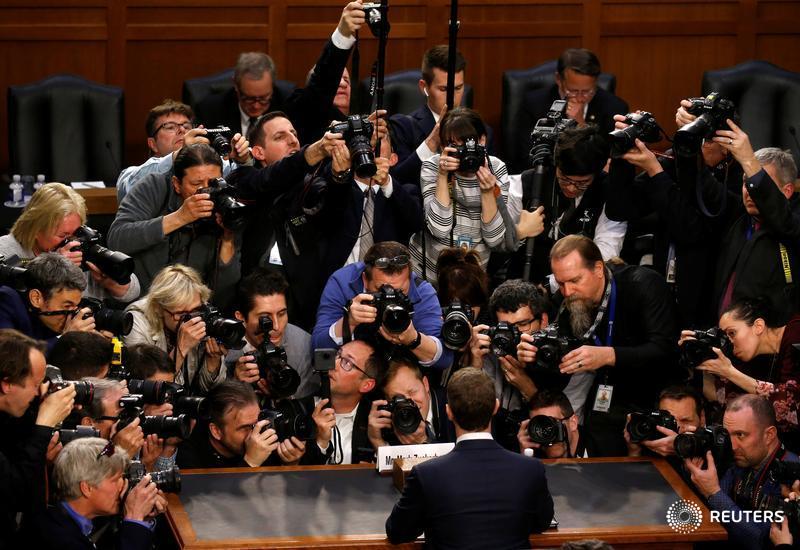 Mark Zuckerberg being photographed during congressional hearings in April